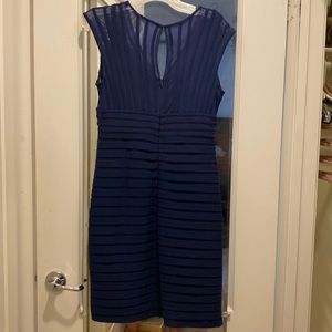 Navy blue dress, falls right above the knee. Size 8